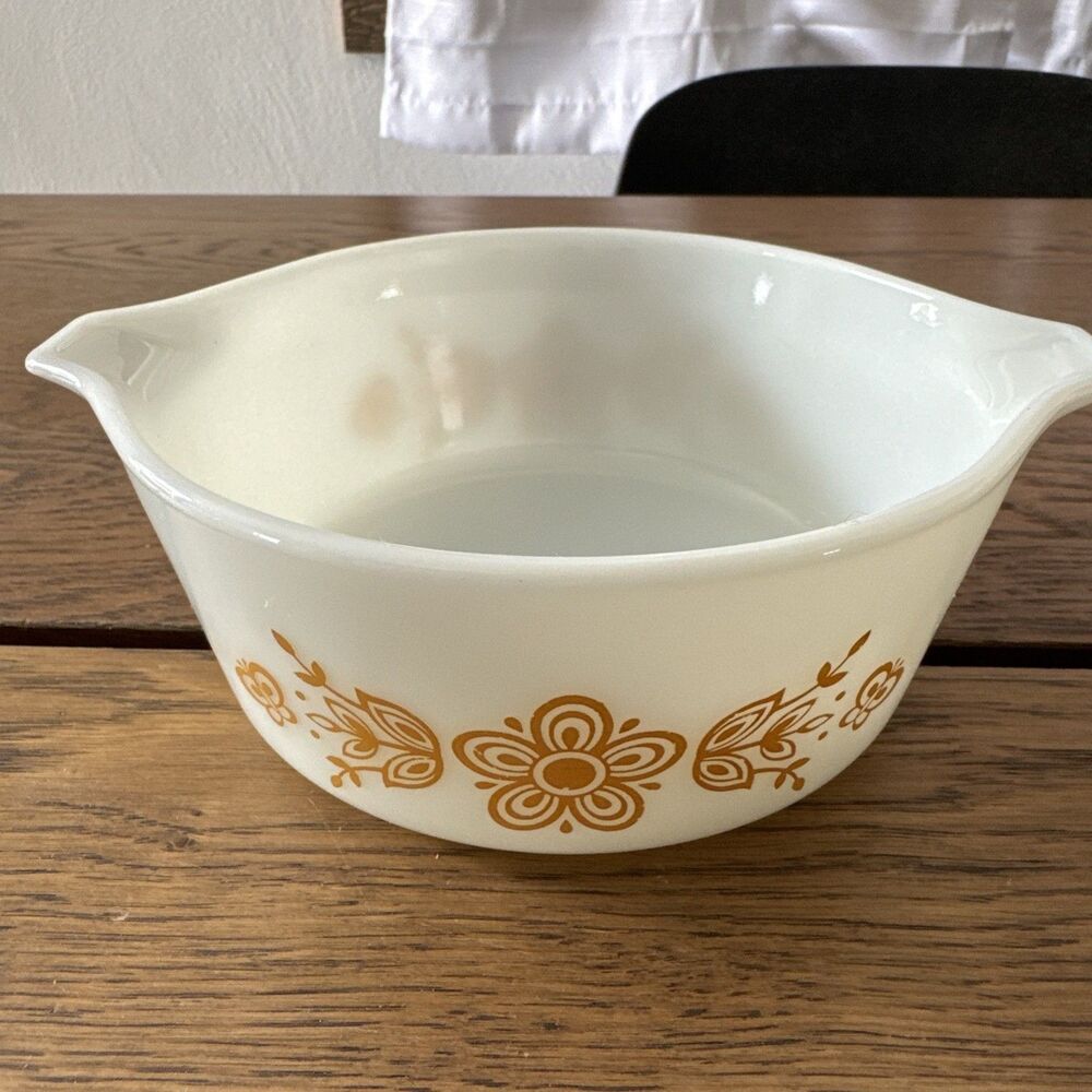 Pyrex Butterfly Gold Cinderella bowl features the iconic 1970s floral  in gold